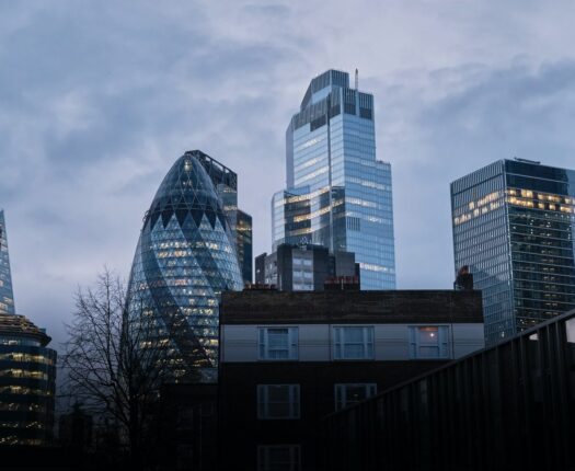 London skyline with Gherkin building on a cloudy day.
