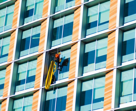 Window cleaner in London working on a high rise building.