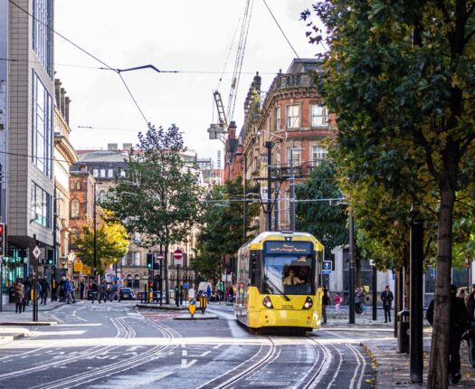 Manchester, featuring a yellow tram.