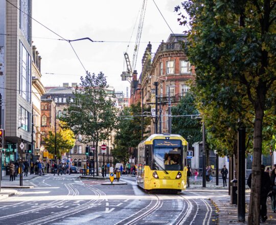 Manchester, featuring a yellow tram.
